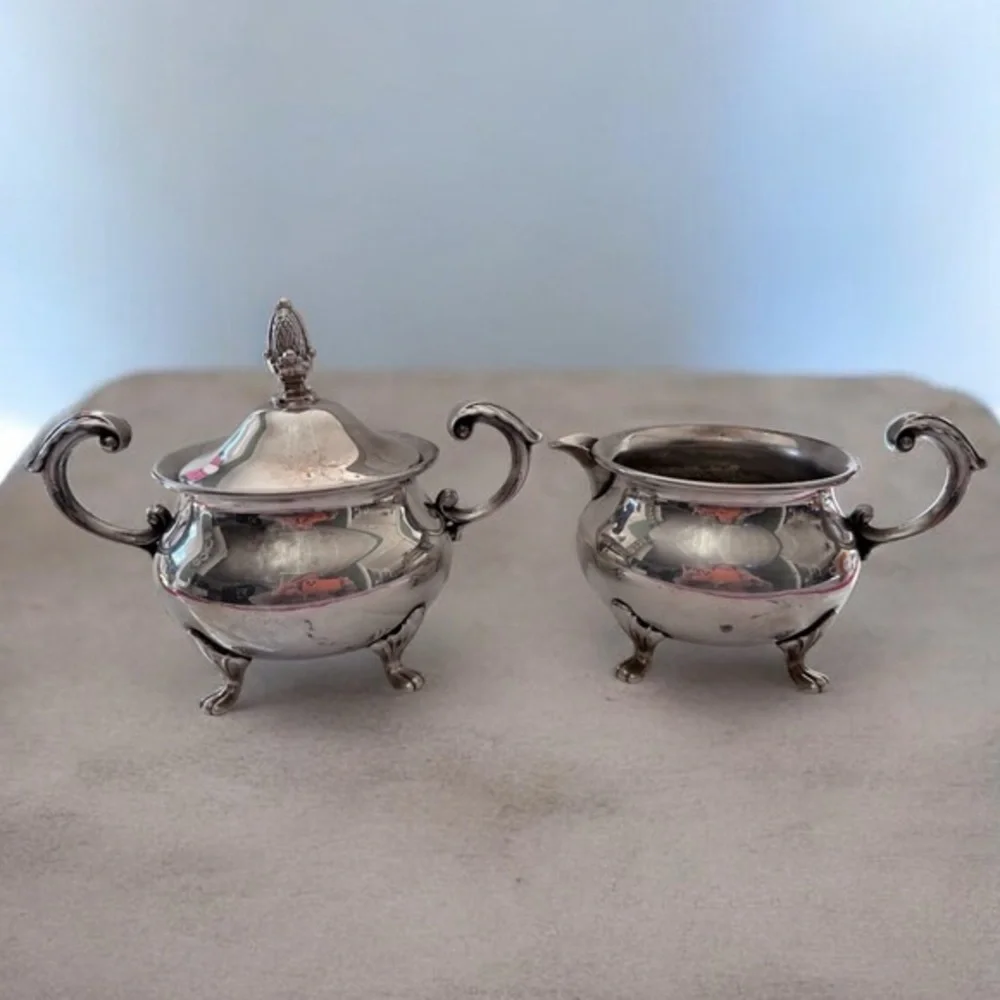 vintage EPCA Bristol by Poole ornate silver-plated sugar bowl and a creamer.